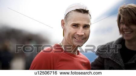 Portrait of middle aged male runner with white cap, Regina, Saskatchewan View Large Photo Image Stock Photograph - Portrait of middle aged male runner with white cap, Regina, Saskatchewan. Fotosearch