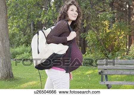 Profile of pregnant woman with hemp backpack, Manitoba, Canada View Large Photo Image Stock Photograph - Profile of pregnant woman with hemp backpack, Manitoba, Canada. Fotosearch