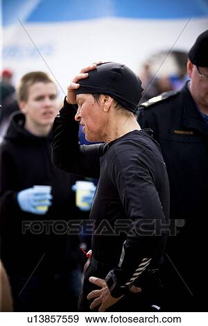 Senior female runner with hand on head, after race, Regina, Saskatchewan View Large Photo Image Stock Photo - Senior female runner with hand on head, after race, Regina, Saskatchewan. Fotosearch