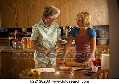 Senior woman and her twelve year old great granddaughter baking; Redvers, Saskatchewan, Canada View Large Photo Image Stock Image - Senior woman and her twelve year old great granddaughter baking; Redvers, Saskatchewan, Canada. Fotosearch