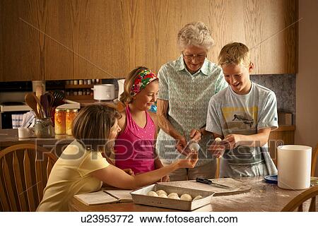 Senior woman, grandaughter and 2 great grandchildren preparing buns to bake; Redvers, Saskatchewan, Canada View Large Photo Image Stock Image - Senior woman, grandaughter and 2 great grandchildren preparing buns to bake; Redvers, Saskatchewan, Canada. Fotosearch