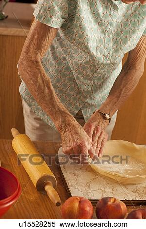 Senior womans hands placing pastry into pie plate, Redvers, Saskatchewan, Canada View Large Photo Image Stock Photography - Senior womans hands placing pastry into pie plate, Redvers, Saskatchewan, Canada. Fotosearch
