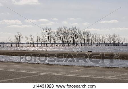 Spring floodwater of Red River come close to covering highway View Large Photo Image Stock Image - Spring floodwater of Red River come close to covering highway. Fotosearch