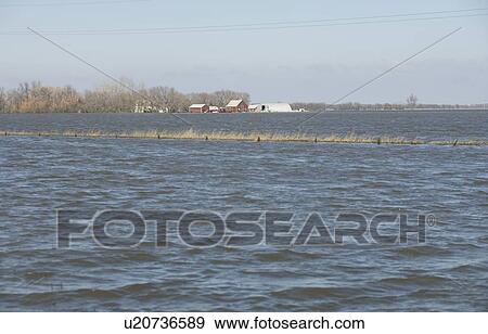 Spring floodwaters of the Red River make an island of a framyard, rural Manitoba View Large Photo Image Stock Photo - Spring floodwaters of the Red River make an island of a framyard, rural Manitoba. Fotosearch