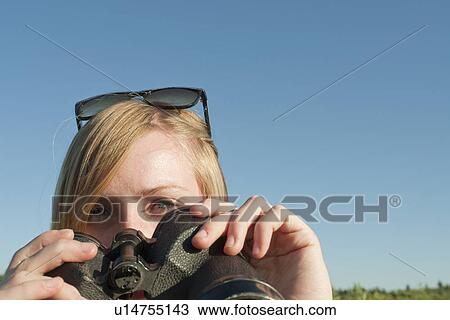 Teen girl holding binoculars toward camera, Riding Mountain National Park, Manitoba, Canada View Large Photo Image Stock Image - Teen girl holding binoculars toward camera, Riding Mountain National Park, Manitoba, Canada. Fotosearch