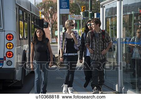 Teens walking away from transit shelfter, Winnipeg, Manitoba, Canada View Large Photo Image Stock Photo - Teens walking away from transit shelfter, Winnipeg, Manitoba, Canada. Fotosearch