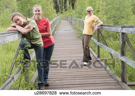 Three women on boardwalk nature trail, Riding Mountain National Park, Manitoba, Canada View Large Photo Image Stock Photo - Three women on boardwalk nature trail, Riding Mountain National Park, Manitoba, Canada. Fotosearch