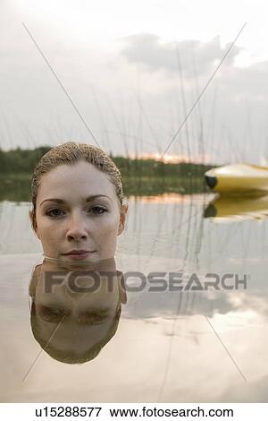 Top portion of young woman's head above the water, Lake Katherine, Riding Mountain National Park, Manitoba, Canada View Large Photo Image Stock Photo - Top portion of young woman's head above the water, Lake Katherine, Riding Mountain National Park, Manitoba, Canada. Fotosearch