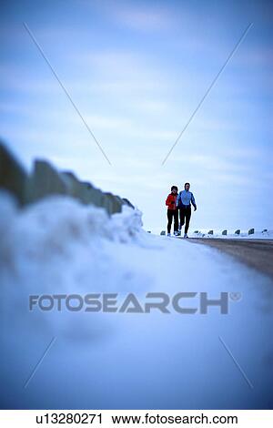 Two runners coming round the curve of snowy road, Regina, Saskatchewan View Large Photo Image Stock Image - Two runners coming round the curve of snowy road, Regina, Saskatchewan. Fotosearch