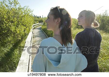 Two teen girls on nature boardwalk, Riding Mountain National Park, Manitoba, Canada View Large Photo Image Stock Photo - Two teen girls on nature boardwalk, Riding Mountain National Park, Manitoba, Canada. Fotosearch