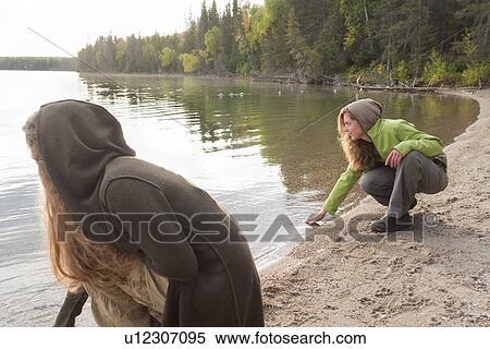 Two women on shoreline of Clear Lake, Riding Mountain National Park, Manitoba, Canada View Large Photo Image Stock Photography - Two women on shoreline of Clear Lake, Riding Mountain National Park, Manitoba, Canada. Fotosearch