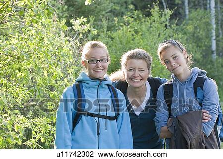 Woman and 2 girls outdoor for hike in poplar grove, Manitoba, Canada View Large Photo Image Stock Image - Woman and 2 girls outdoor for hike in poplar grove, Manitoba, Canada. Fotosearch