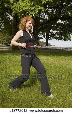 Woman using yoga bands, Vancouver, BC View Large Photo Image Stock Image - Woman using yoga bands, Vancouver, BC. Fotosearch