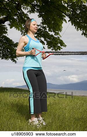 Woman using yoga bands, Vancouver, BC View Large Photo Image Stock Image - Woman using yoga bands, Vancouver, BC. Fotosearch