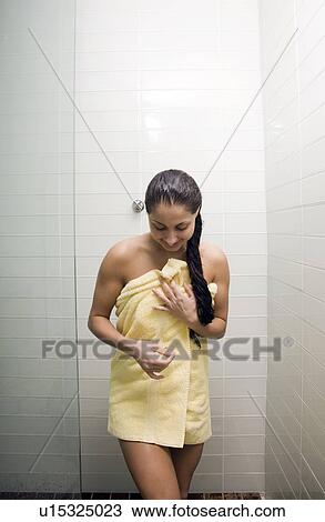Woman wapped in towel in shower stall View Large Photo Image Stock Image - Woman wapped in towel in shower stall. Fotosearch