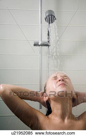 Stock Photography - Young girl in low-flow shower. Fotosearch