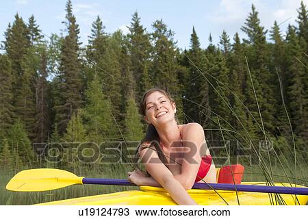 Young woman in yellow kayak, Lake Katherine, Riding Mountain National Park, Manitoba, Canada View Large Photo Image Stock Image - Young woman in yellow kayak, Lake Katherine, Riding Mountain National Park, Manitoba, Canada. Fotosearch