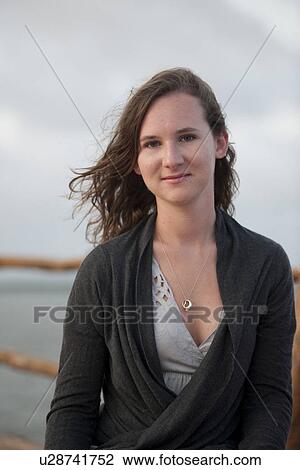 Stock Image - 17 year old girl smiling at camera. Fotosearch