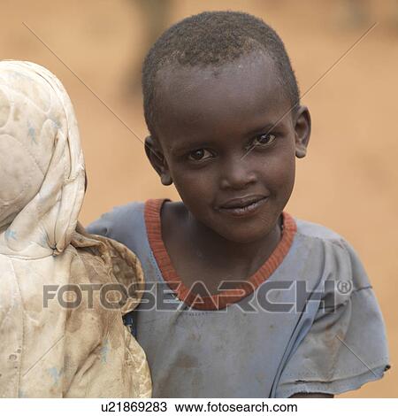 Stock Image - African child in Maasai Village, Africa. Fotosearch
