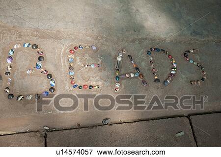 Stock Photo - Beads in a sign. Fotosearch