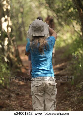 Stock Image - Caucasian girl hiking in Kenya Africa. Fotosearch