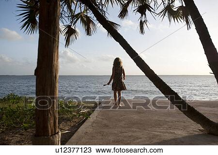 Stock Image - Girl at Manda Bay Resort. Fotosearch