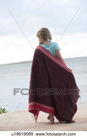Girl on beach in Kenya View Large Photo Image Stock Photo - Girl on beach in Kenya. Fotosearch