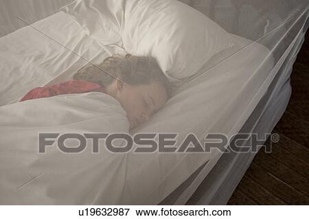 Stock Photo - Girl sleeping at Manda Bay Resort. Fotosearch