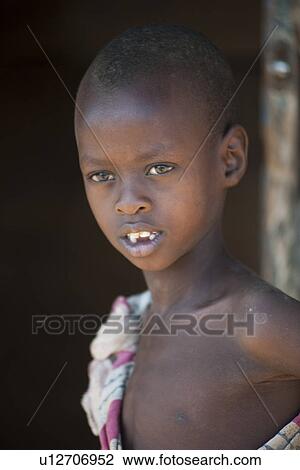 Stock Image - Kenyan child in tribal attire. Fotosearch