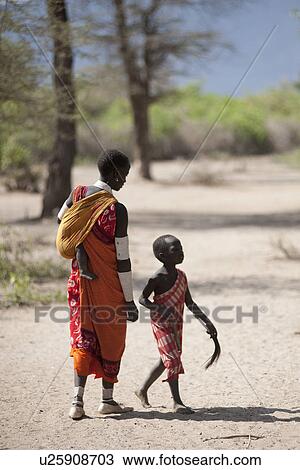 Stock Image - Kenyan children in tribal attire. Fotosearch