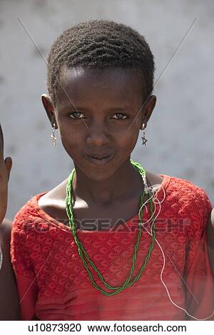 Stock Image - Kenyan girl in tribal attire. Fotosearch