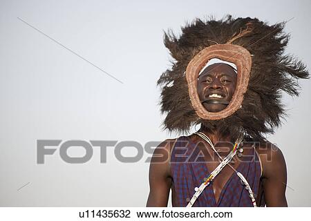 Stock Image - Kenyan man in tribal attire. Fotosearch