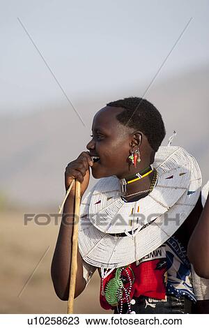 Stock Image - Kenyan woman in tribal attire. Fotosearch