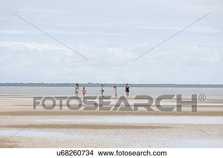 People along shoreline at Manda Bay Resort View Large Photo Image Picture - People along shoreline at Manda Bay Resort. Fotosearch