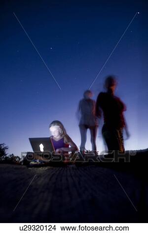 Picture - Silhouette of people gainst Kenya sky at sunset. Fotosearch