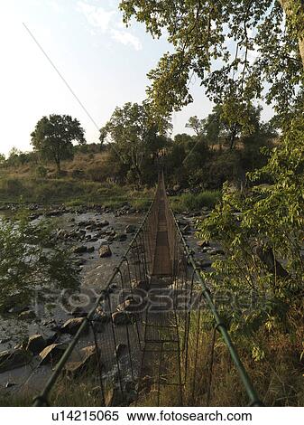 Stock Photography - Suspension bridge and stream Kenya Africa. Fotosearch