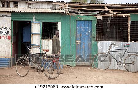 Villager by hut in Kenya View Large Photo Image Stock Photo - Villager by hut in Kenya. Fotosearch