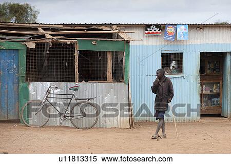 Villager by hut in Kenya View Large Photo Image Stock Photography - Villager by hut in Kenya. Fotosearch