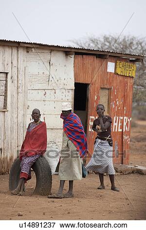 Villagers by hut in Kenya View Large Photo Image Stock Photo - Villagers by hut in Kenya. Fotosearch