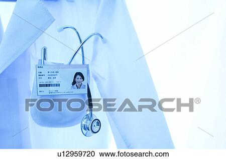 Stock Image - A lab coat with stethoscope and name tag. Fotosearch