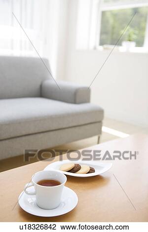 Afternoon tea and biscuits in living room View Large Photo Image Stock Image - Afternoon tea and biscuits in living room. Fotosearch