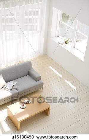 Stock Image - Afternoon tea in living room. Fotosearch