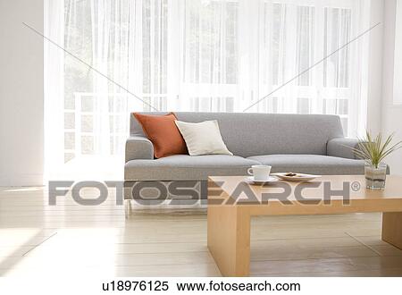 Stock Photography - Afternoon tea in living room. Fotosearch