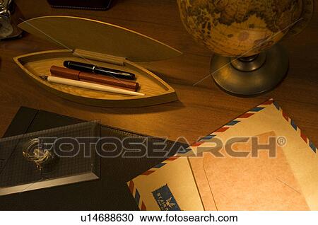 Air mail on desk with pens and globe View Large Photo Image Stock Image - Air mail on desk with pens and globe. Fotosearch