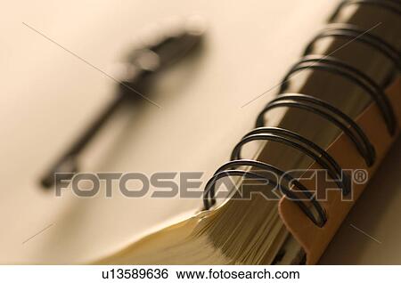 Antique key on a notebook View Large Photo Image Stock Photograph - Antique key on a notebook. Fotosearch