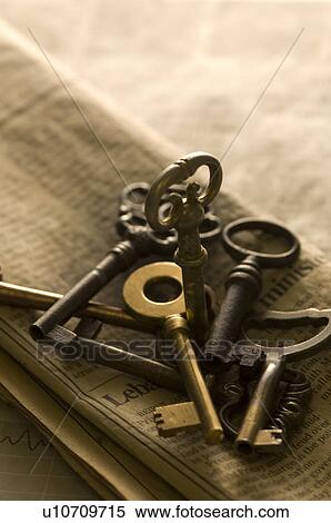 Antique keys on a newspaper View Large Photo Image Stock Photography - Antique keys on a newspaper. Fotosearch