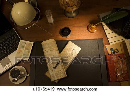 Stock Photo - Antique office supplies on desk with laptop and coffee. Fotosearch