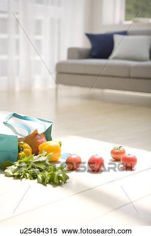 Bag of vegetables spilling onto living room floor View Large Photo Image Stock Photography - Bag of vegetables spilling onto living room floor. Fotosearch