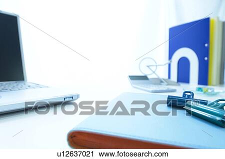 Binder clips, file and laptop on desk View Large Photo Image Stock Image - Binder clips, file and laptop on desk. Fotosearch