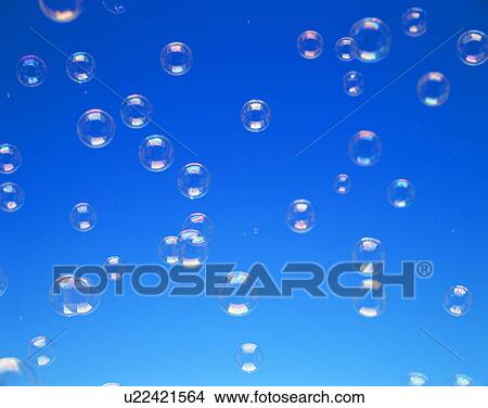 Bubbles against blue sky View Large Photo Image Picture - Bubbles against blue sky. Fotosearch